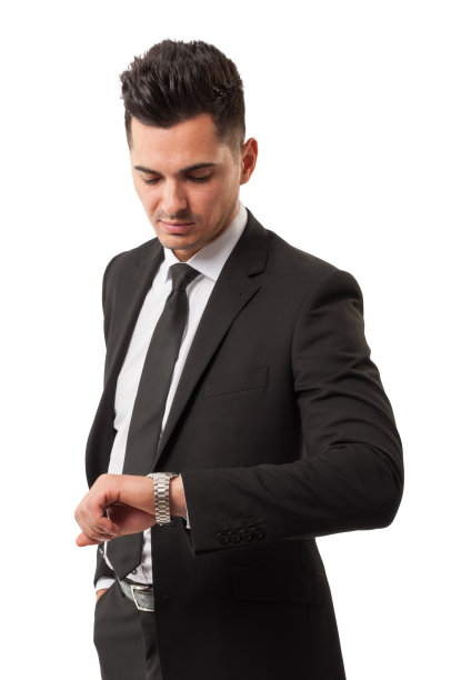 商人正在看他的手表，因为是时候赚钱了图片下载