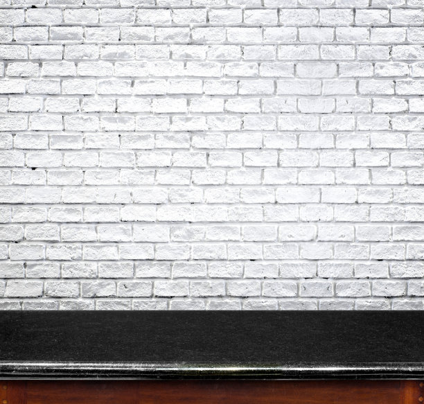 空白的黑色大理石桌子和白色砖墙的背景图片下载