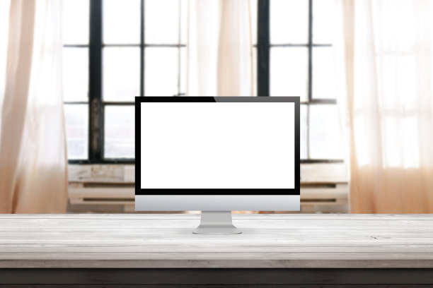 电脑显示在书桌和家庭办公室内部图片下载
