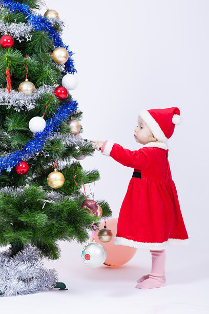 圣诞女婴戴着圣诞老人的帽子图片下载