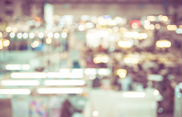 模糊的背景:人们在展览中行走的俯视图图片下载