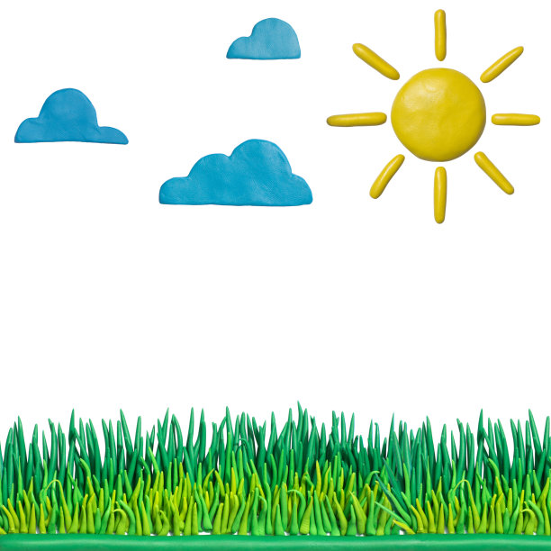粘土油灰，橡皮泥手工云彩，太阳和绿色的草地。图片下载