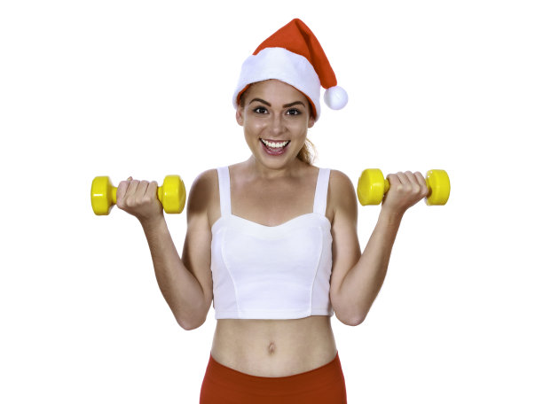 年轻女子在圣诞节用哑铃锻炼图片下载