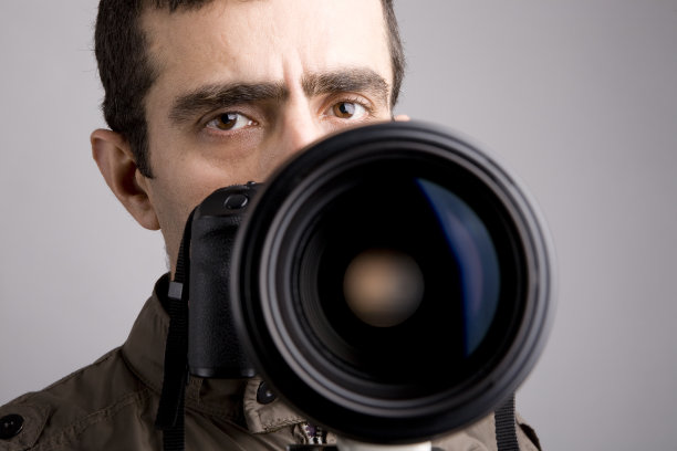 单反相机后的摄影师自画像图片下载