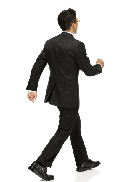 商人行走的后视图图片下载