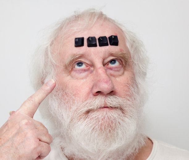 高级职员指着帮助电脑键盘的座右铭图片下载