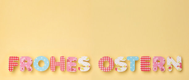 可爱的字母在黄色Deutsch: Frohes Ostern图片下载