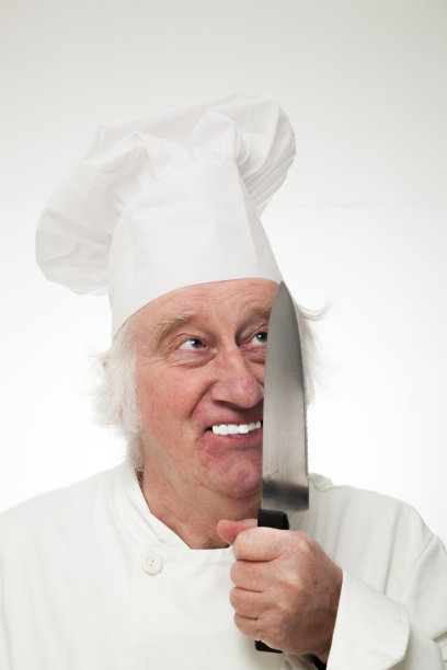 疯狂的滑稽的傻乎乎的厨师与大刀孤立在白色图片下载