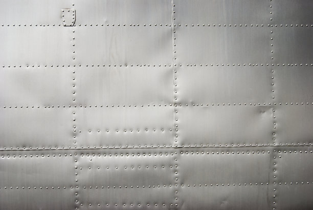 飞机侧壁背景用铆钉和柔和的阴影图片下载