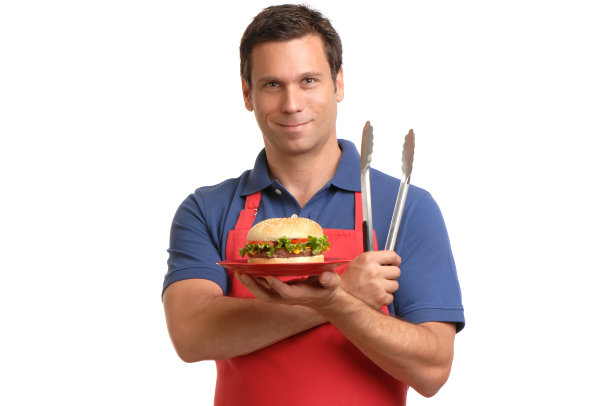 烧烤主厨配汉堡围裙和夹钳图片下载