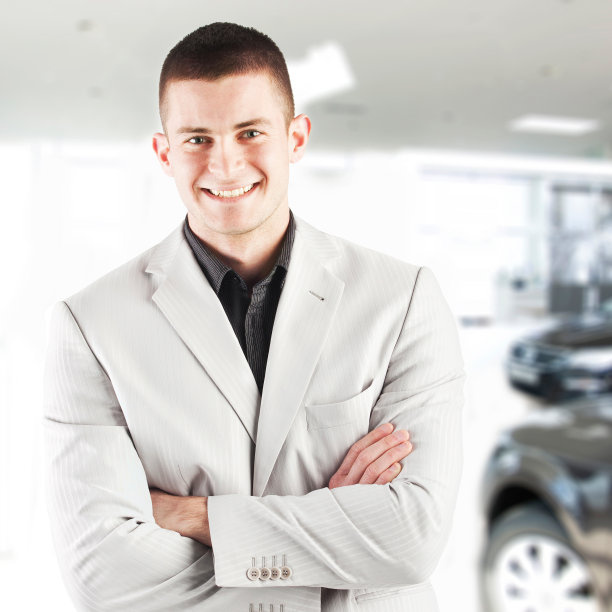 一个微笑的年轻商人的肖像图片下载