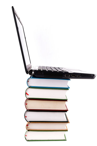 网上图书馆:笔记本电脑和书籍图片下载