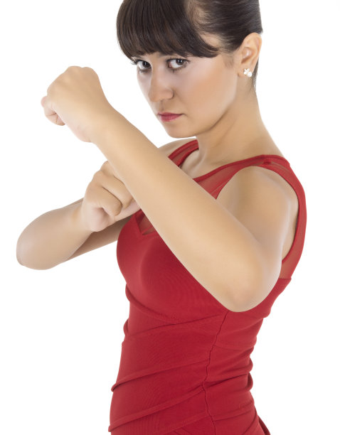 年轻女子紧握拳头图片下载