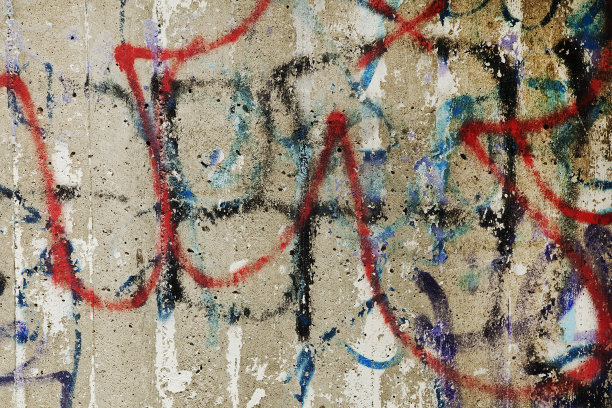 混凝土墙上五颜六色的涂鸦。图片下载