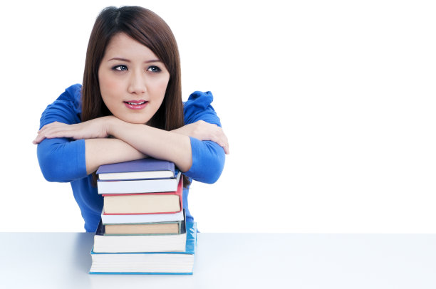 可爱的学生在书本上休息图片下载