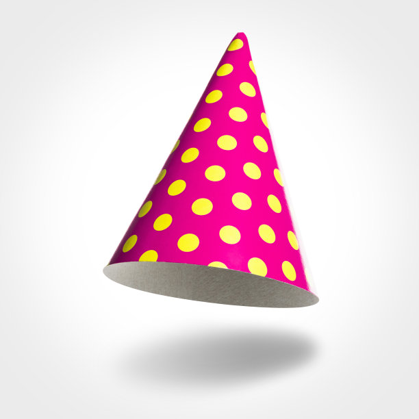 粉红色的派对帽在空中，黄色的斑点孤立在白色图片下载