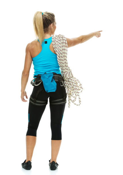 女性攀岩者指向的后视图图片下载