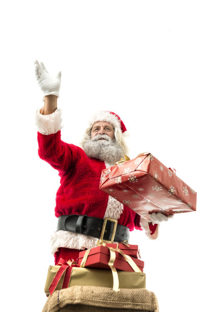 圣诞老人抱着一份礼物孤立在白色图片下载