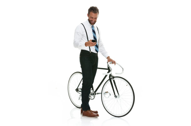 微笑的商人用手机和自行车图片下载