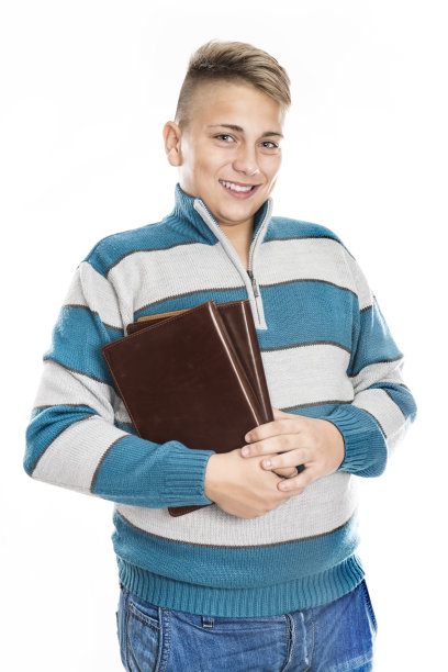可爱的十几岁的学生男孩如何持有学校的书图片下载