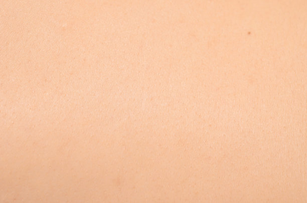 特写纹理浅肤色皮肤与美人痣图片下载