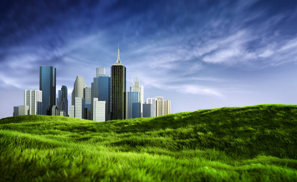 阳光明媚的市中心天际线和干净的绿草地图片下载