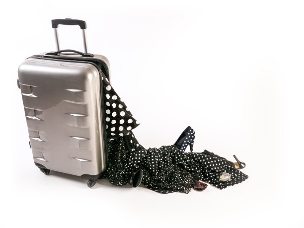 损坏的手提箱纺纱机失去了它的波尔卡点女性内容图片下载