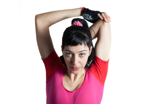 女运动员在做完体操后做伸展运动图片下载