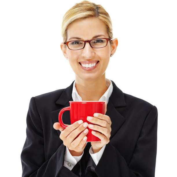 快乐的年轻女商人拿着红色的咖啡杯图片下载