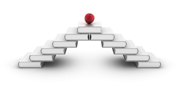 楼梯上的书和一个苹果。图片下载