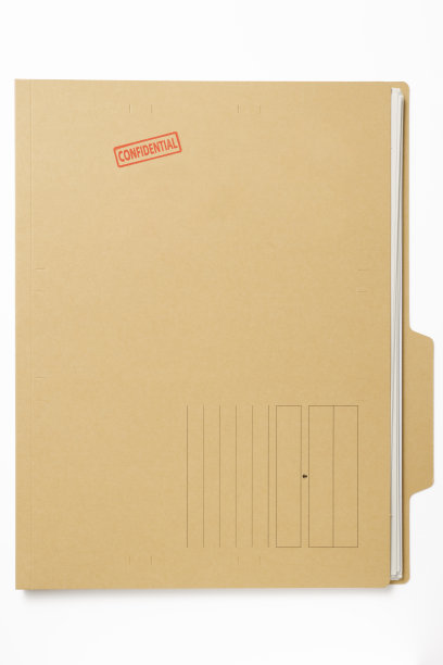 “机密”橡皮图章的文件与文件的白色背景图片下载