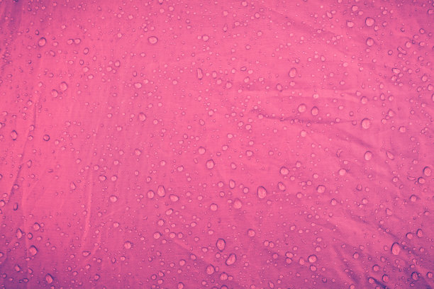 粉红纹理上的水滴图片下载