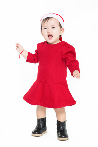 带着圣诞帽的圣诞小女孩张开了她的嘴图片下载