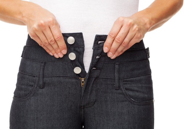 女扣牛仔裤-孤立图片下载