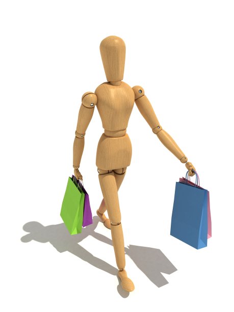 女人拿着购物袋走在路上图片下载