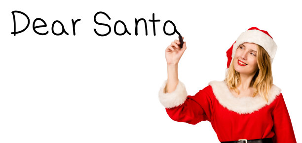 穿着圣诞老人服装的女人用马克笔写字图片下载