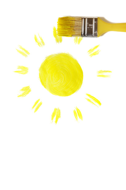 画笔用黄色颜料(在白色上)画着太阳图片下载