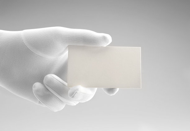 白色名片/带白色手套的手/拷贝空间图片下载