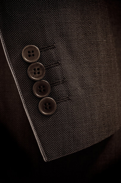 西装袖子和纽扣的特写图片下载