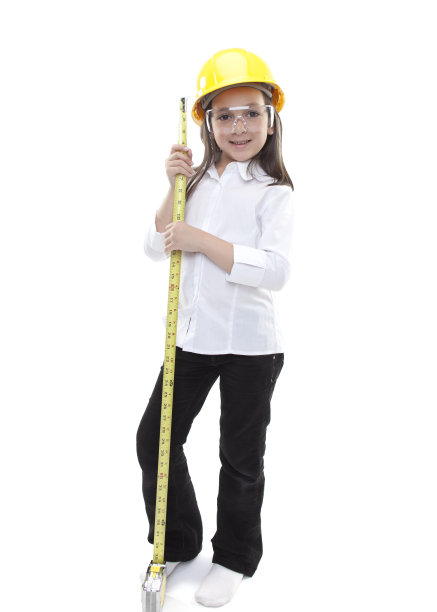 年轻的白人女孩与安全帽和卷尺图片下载