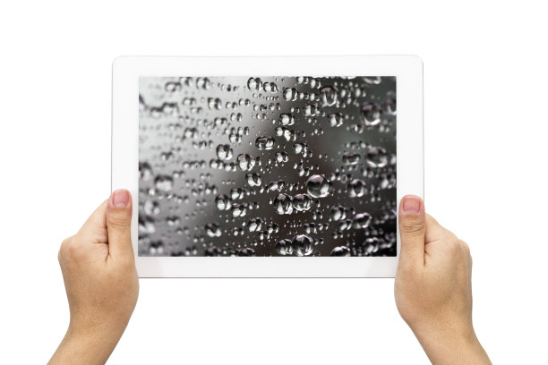 手持数字平板与水滴图片下载