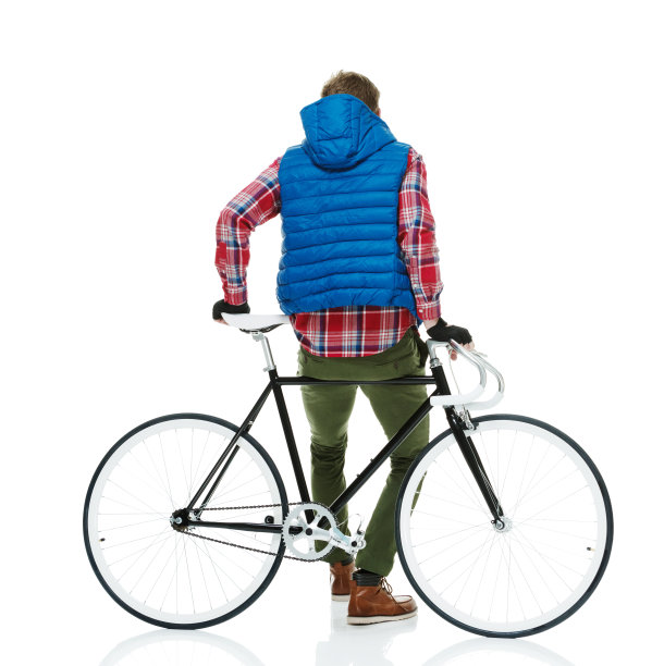 后视图的潮人站在自行车图片下载