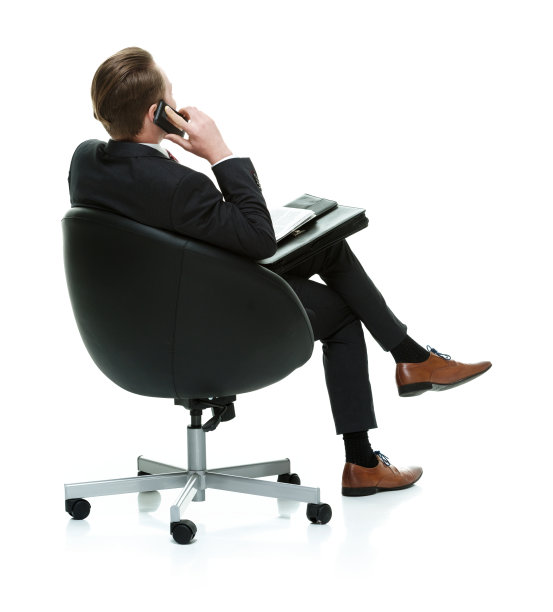 商人坐在椅子上的后视图图片下载