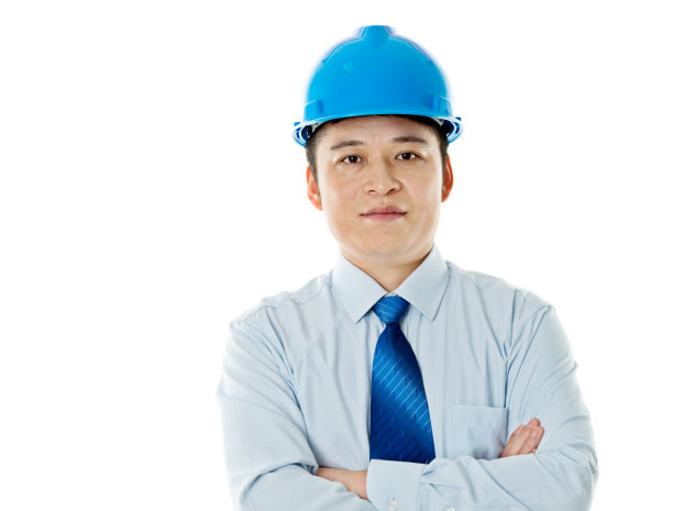 年轻的工程师孤立地站在白色背景上图片下载