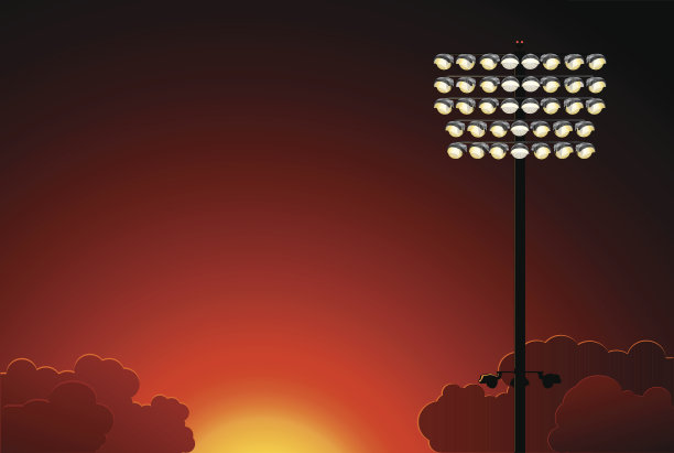 日落时的体育场灯光图片下载