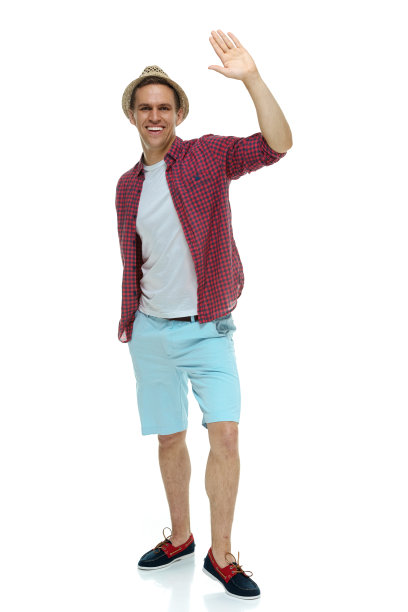 穿着格子衬衫，挥手的快乐男人图片下载