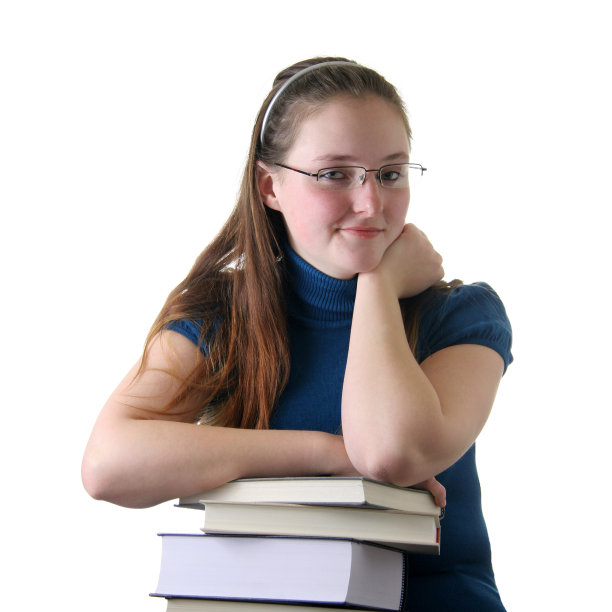 学生倚在一堆书上图片下载