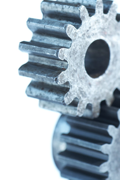 蓝色机器在白色齿轮上转动图片下载