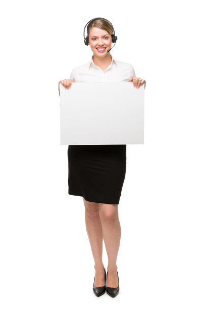 年轻漂亮的女商人戴着耳机和手势图片下载