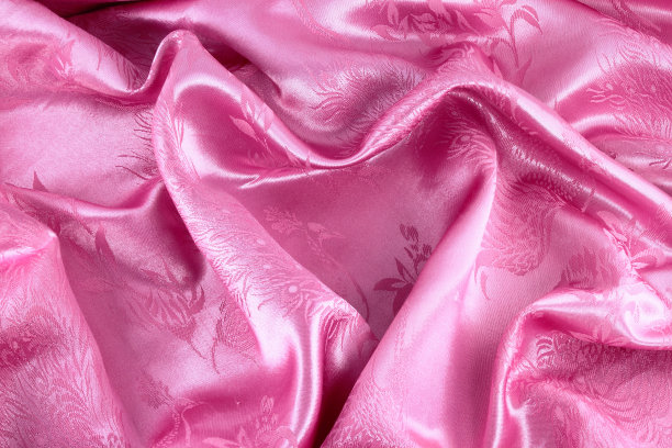 粉色心形缎子作为情人节的背景图片下载